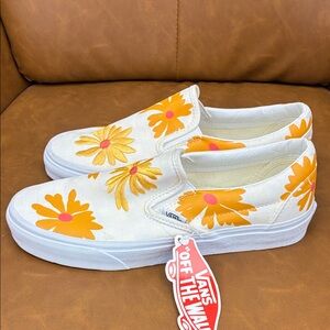 Vans White Slip-Ons with Bold Orange Floral Pattern